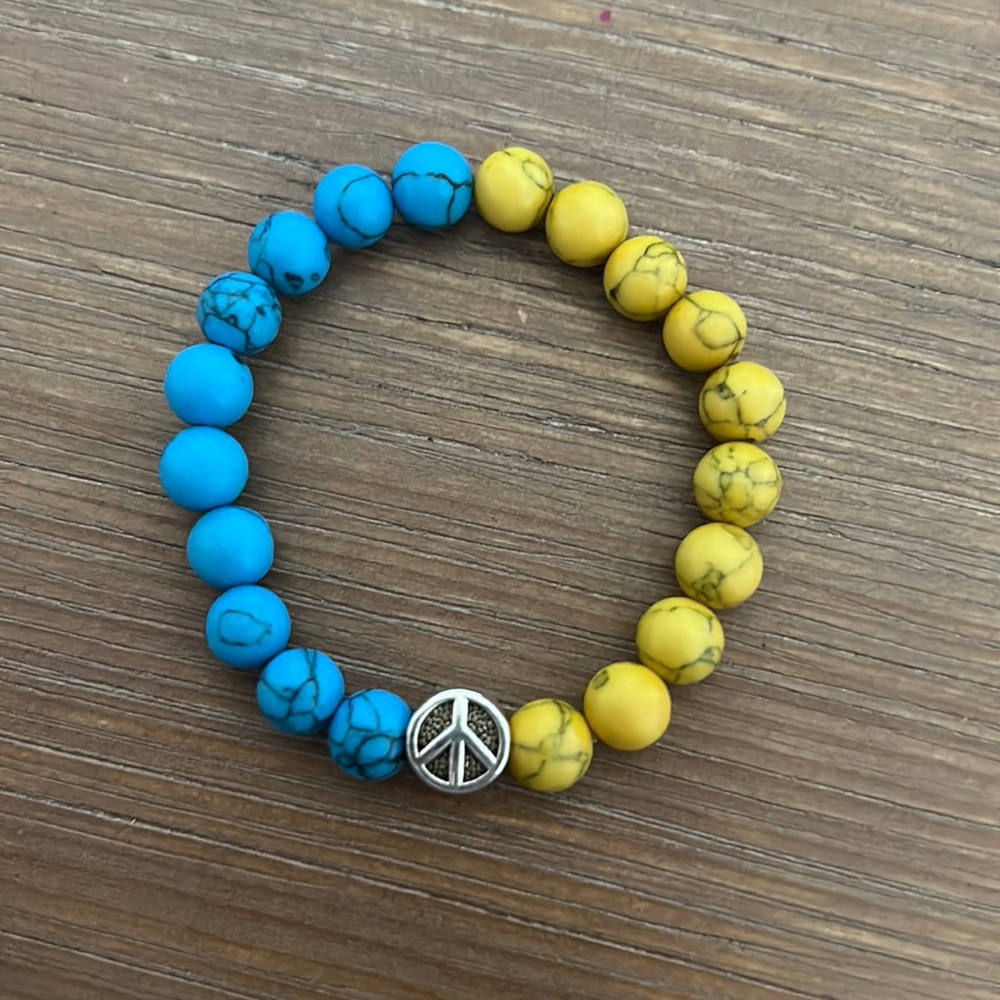 Beaded, blue and yellow peace bracelet